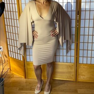 Tan bodycon dress with dramatic sleeves